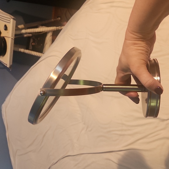 Double-sided vanity mirror, one side magnified.  Silver frame - Picture 4 of 4